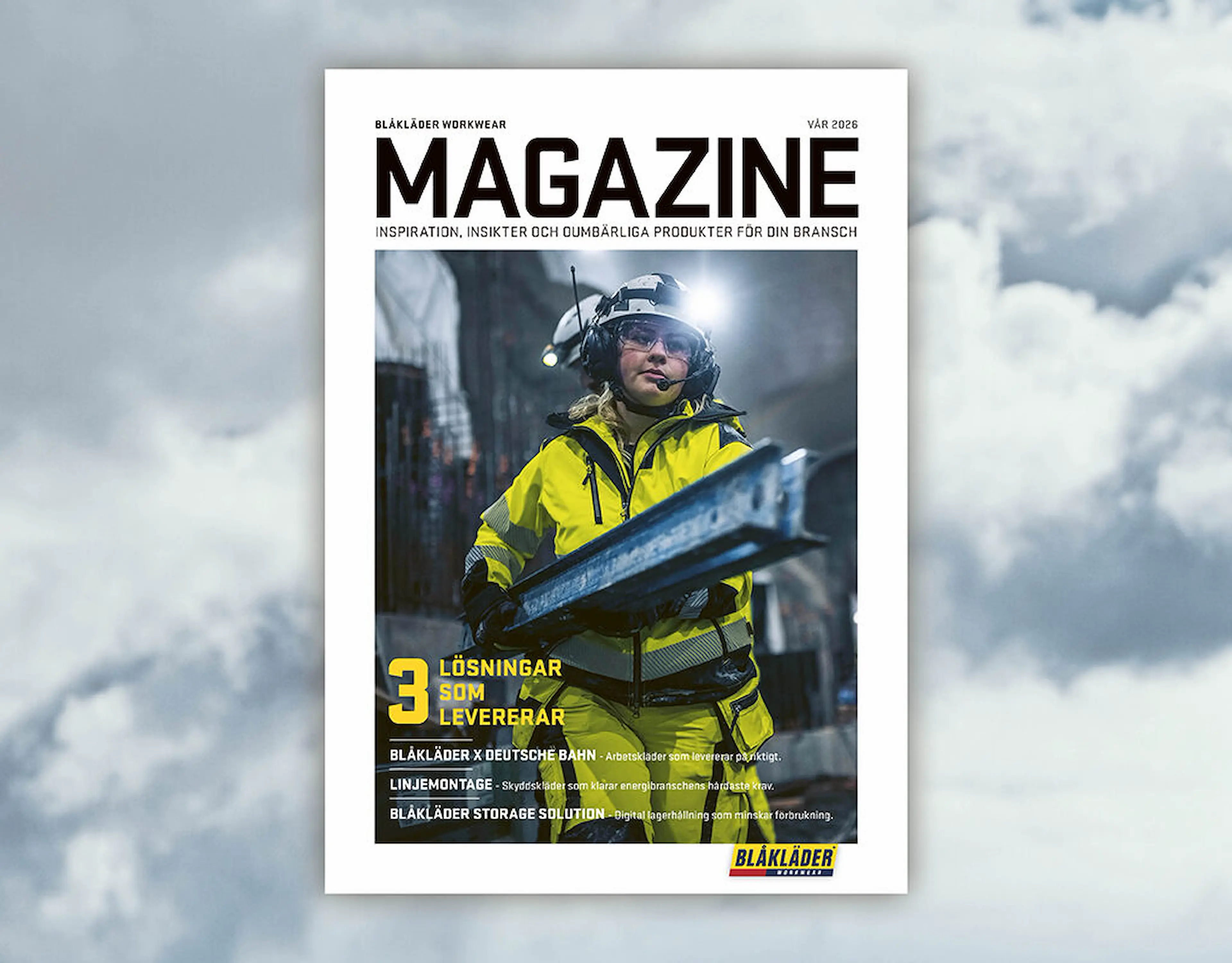 Magazine cover for Blåkläder Workwear (Spring 2026) featuring a construction worker in a high-visibility yellow jacket and helmet with headlamp, holding a metal beam in an industrial urban setting. Headline reads “3 Solutions That Deliver.”