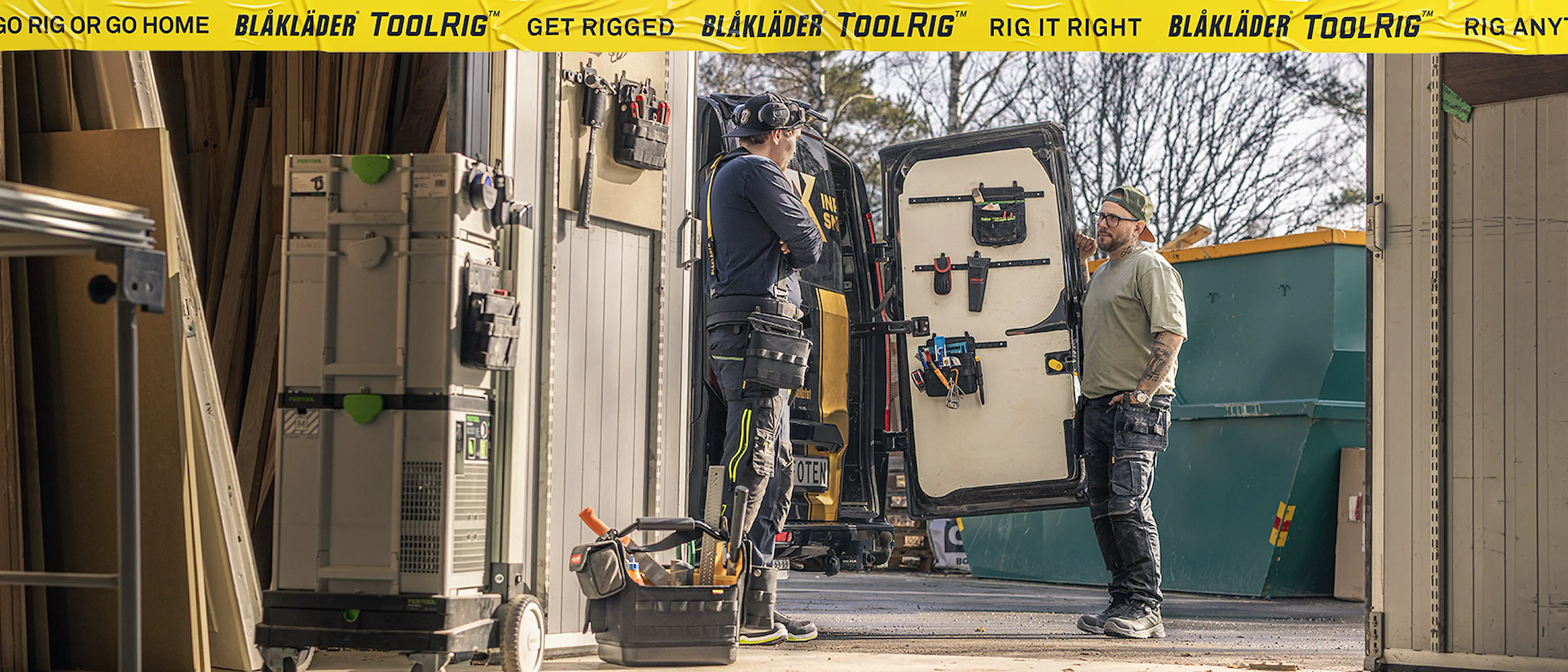 Workers organizing tools inside a service van equipped with the Blåkläder ToolRig system, showcasing a modular and durable mobile storage solution for professional trades.