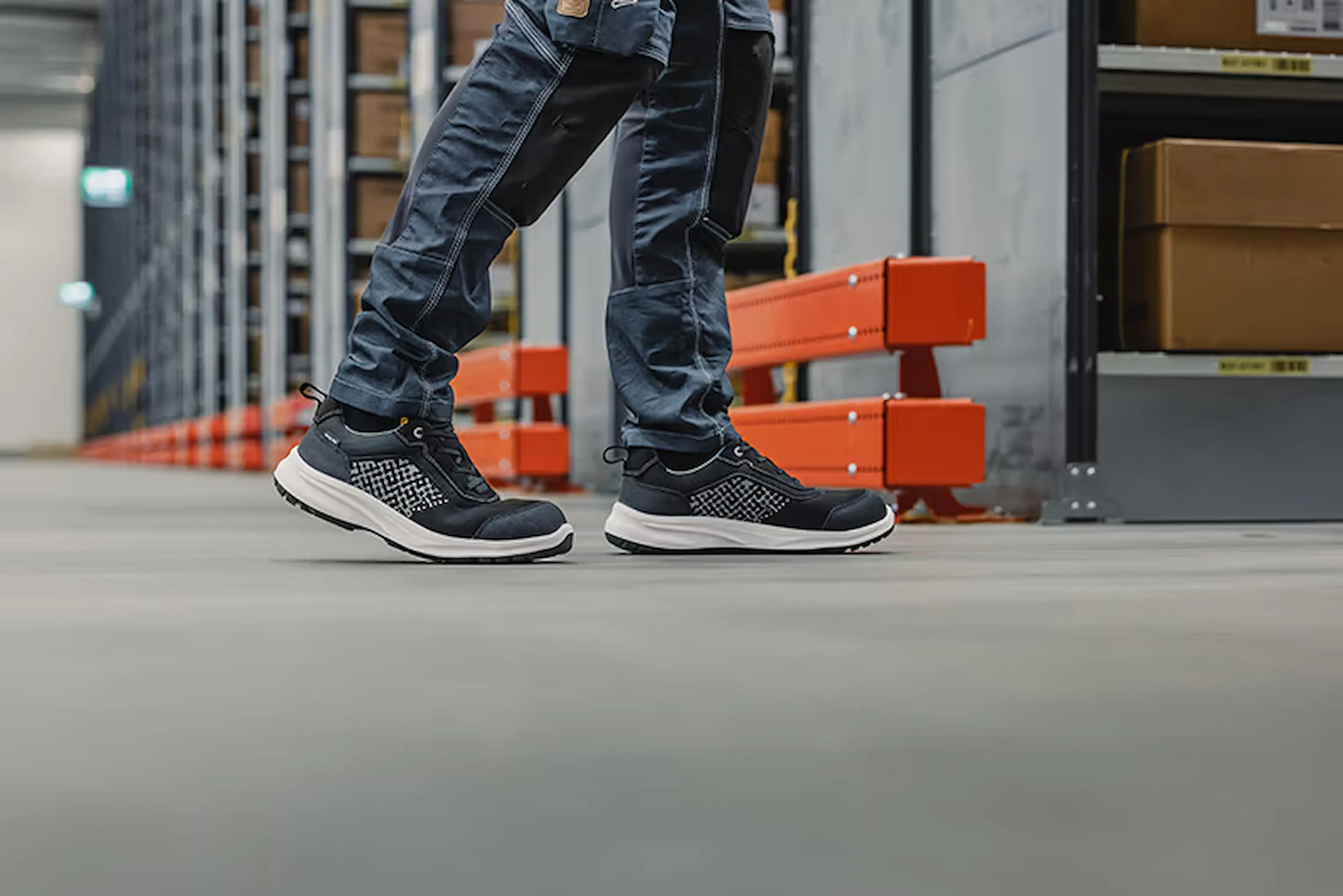 Lightweight Blåkläder safety shoes in action on a warehouse floor, designed for all-day comfort, stability, and reliable grip in demanding work environments.