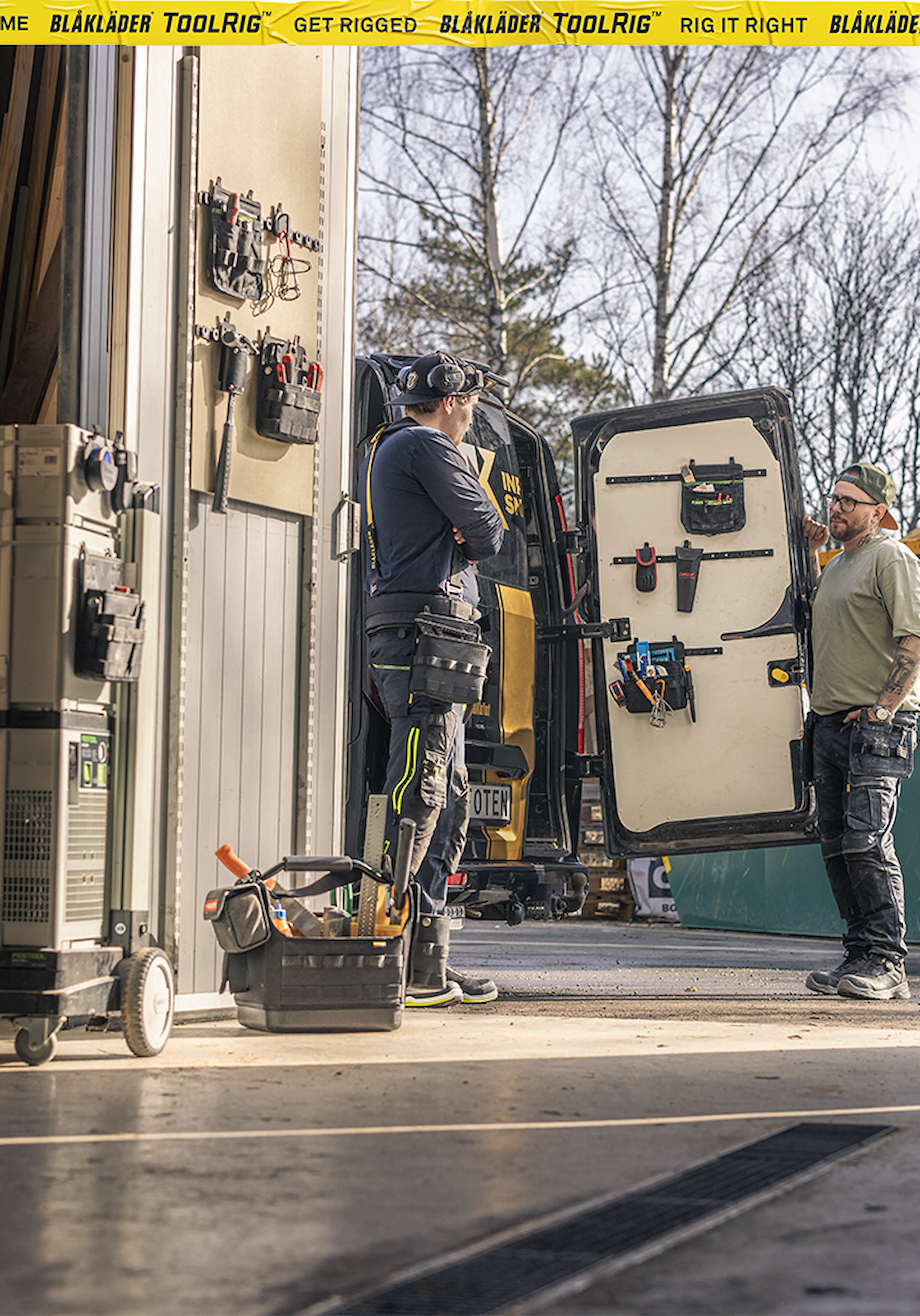 Workers organizing tools inside a service van equipped with the Blåkläder ToolRig system, showcasing a modular and durable mobile storage solution for professional trades.
